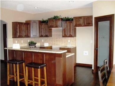 Beautiful Knotty Alder Cabinetry with Staggered Up