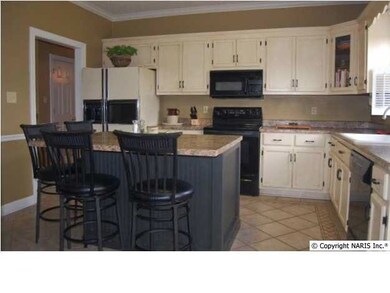 GREAT BIG ISLAND IN HERE ALSO, NOTE TILED FLOOR WITH CUSTOM PATERN