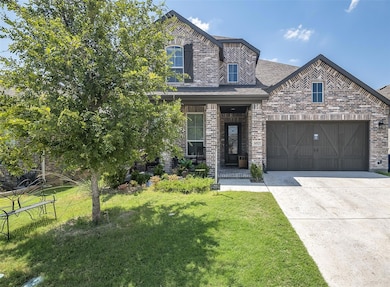 View of front of property featuring a garage and a
