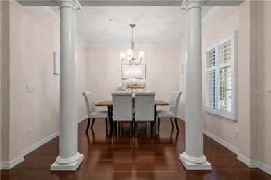 Lovely Dining Room with Crown Molding and Plantation Shutters.