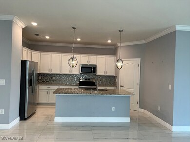 Kitchen with a sink, fridge, range, stainless stee