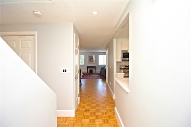 View from Front Door into the Foyer, Hallway, Kitc