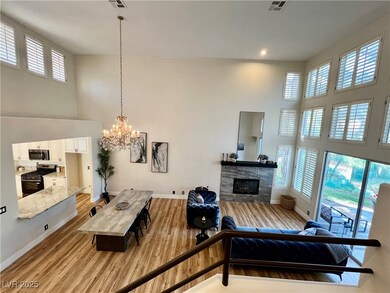 Living room featuring a high ceiling, healthy amou