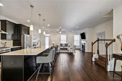 Kitchen featuring sink, hanging light fixtures, st