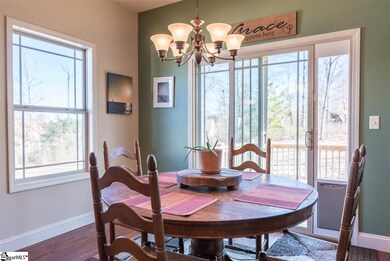 Breakfast room overlooking yard with distant mount