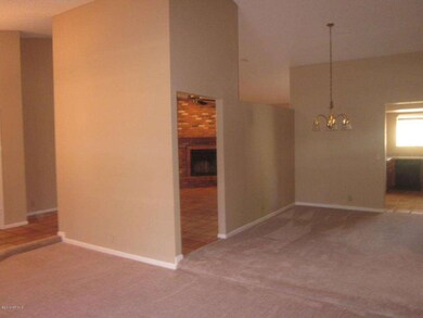 Sunken living room flows to dining room
