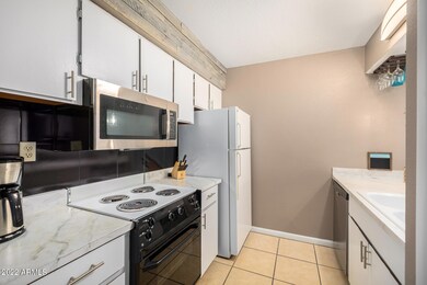 KITCHEN WITH WHITE CABINETS