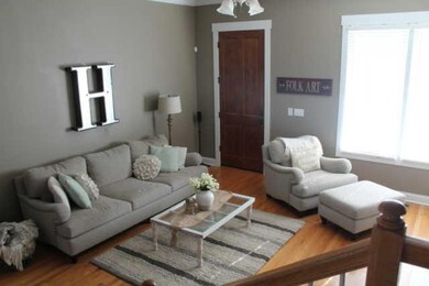 Great room with fireplace and expansive windows.
