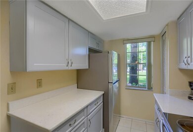 Pantry is the louvered door to the right of the wi