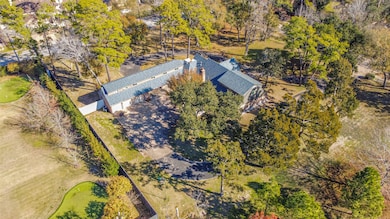 Lush greenery and mature trees enhance this Piney