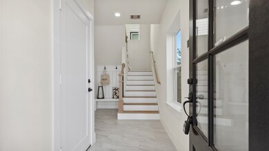 Enter thru the front door to be greeted by bright,