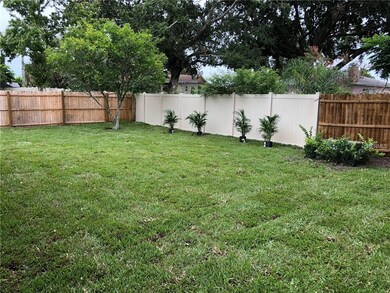 LARGE FENCED YARD. NEW SOD W/SPRINKLERS