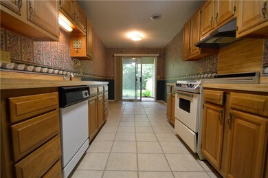Kitchen and eat-in dining area.  Far door leads to