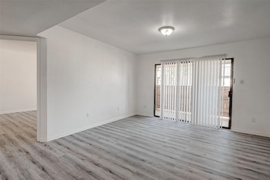 A large living area with attached private balcony