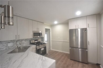 Kitchen with stainless steel appliances.