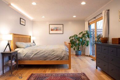 Bedroom with light wood-type flooring, access to o