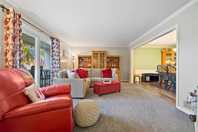 Spacious living room opens to front balcony