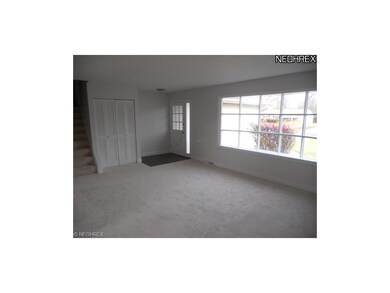 Spacious living room with bay window and new carpe