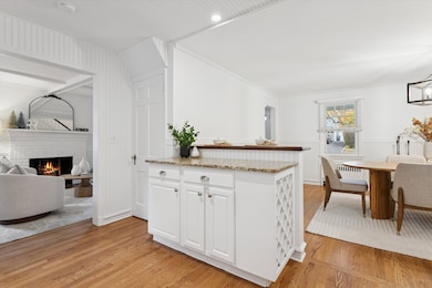 The kitchen is eat in and opens to the dining and family room.