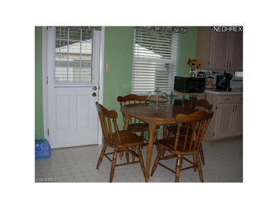 Eat In Kitchen. Notice door to the back patio.