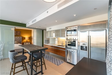 Kitchen featuring light tile patterned flooring, a