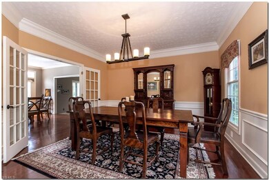 Formal Dining Room with Hardwood Floor is Enhanced