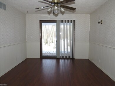 You can access the backyard deck through the patio