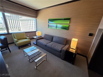 Carpeted living room with baseboards and crown mol