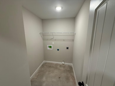 Laundry room featuring hookup for an electric dryer and hookup for a washing machine