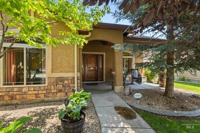 Doorway to property with stone siding and stucco siding