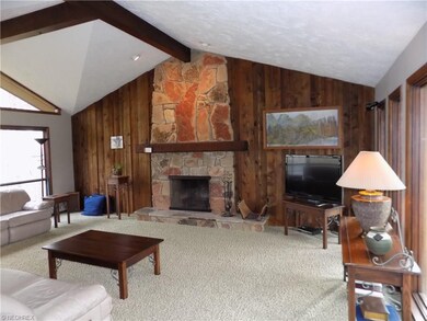Looking at living room from foyer. Wow! Stone and 
