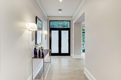 The entry hall is exquisite with the formal living