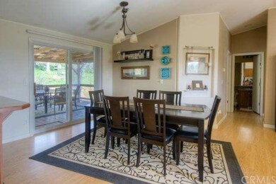 Dining area has large sliding glass door to the ex