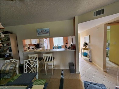 Kitchen featuring light tile patterned flooring, w