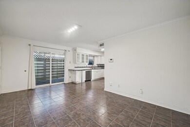 Unfurnished living room featuring baseboards, dark