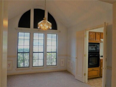 Formal dining room with double doors that leads to