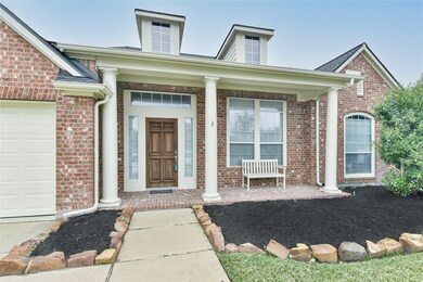 Charming front porch with brick floor to welcome visitors