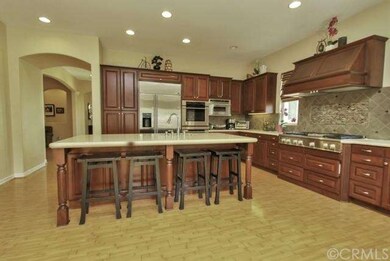UPGRADED KITCHEN WITH CEASERSTONE QUARTZ COUNTER TOP AND HUGE ISLAND