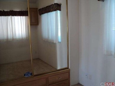 mirrowed closets in bedroom. Storage too.
