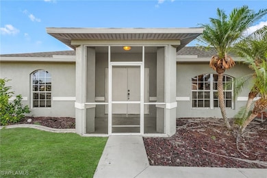 View of exterior entry featuring stucco siding, ro
