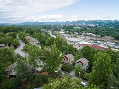 sits high atop Asheville with view to French Broad River and R.A.D. (#276 is in cluster up the street)