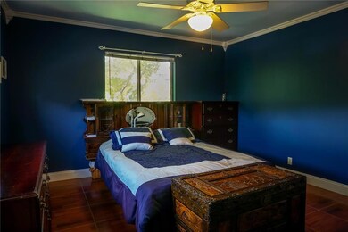 Spacious corner master bedroom with crown