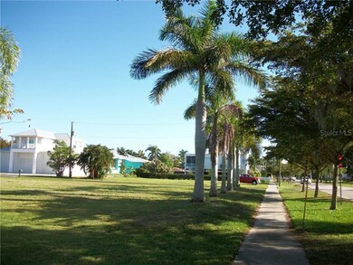 Looking east up Marion Ave six mature Queen Palm t