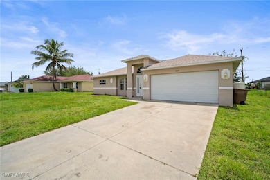 Ranch-style home with stucco siding, concrete driv