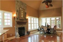 Dining Room is very much open to the kitchen. This is one super large room with the table area plus a breakfast area, double bar plus a coffee bar, stone fireplace with custom floor enlays, entertain to your heart's desire. 