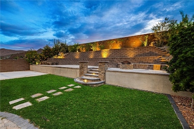 Yard at dusk featuring a patio area