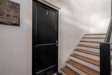 Hallway leading up the stairs.
