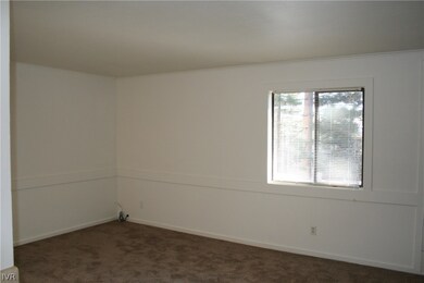 Great Room with  window and tree view.