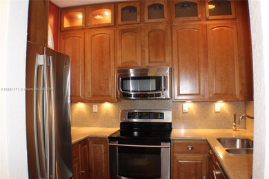 Lots of cabinets and lighting in kitchen 