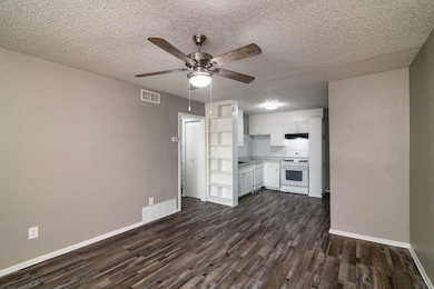 Kitchen featuring light countertops, white applian